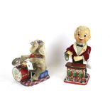 Two vintage tinplate clockwork toys.