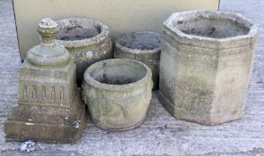 Four large garden stone plant pots. Three of circular form and the other octagonal.