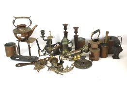 An assortment of 19th century and later metalware. Including a trivet, kettle and candlesticks, etc.