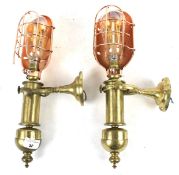 A pair of vintage brass gimble ships wall lamps.