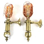 A pair of vintage brass gimble ships wall lamps.