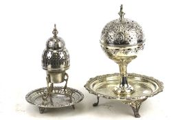 Two contemporary white metal incense burners on stands. Decorative engraving and piercework. Max.