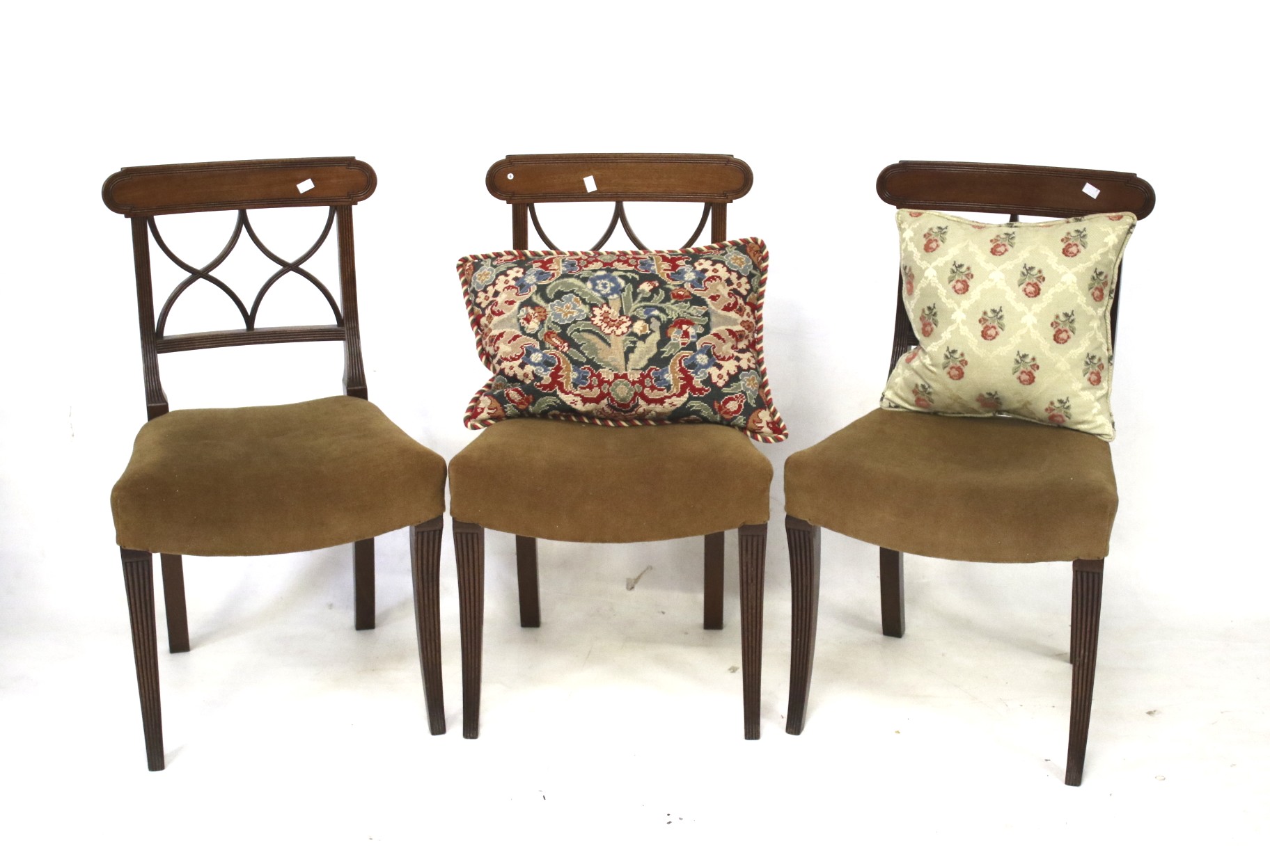 A set of three early 19th century mahogany dining chairs.