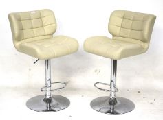 A pair of 20th century adjustable stools. With cream leather seats and chrome stands, Max.