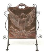 An Arts and Crafts copper and wrought iron firescreen.