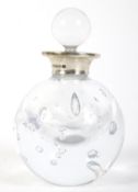 A contemporary silver topped glass scent bottle.