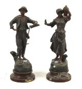 A pair of 20th century spelter figures.