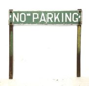 A vintage metal 'No Parking' sign.