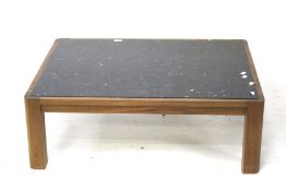A contemporary marble topped coffee table.