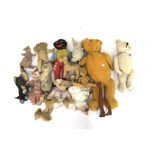 A collection of vintage teddy bears and soft toys.