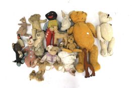 A collection of vintage teddy bears and soft toys.