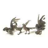 Two pairs of cast metal bird ornaments.