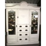 A large white painted wardrobe.