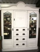 A large white painted wardrobe.