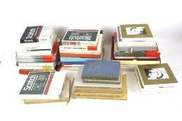 A box of assorted reel to reel magnetic recording tape, classical music books.