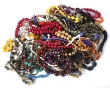 An assortment of costume jewellery. Including beads, necklaces, buttons, etc.