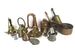 An assortment of vintage metalware. Including a set of four copper saucepans, etc.
