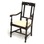 A 19th century oak armchair.