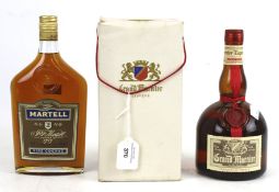 A bottle of Martell cognac and a bottle of Grand Marnier Triple Orange.