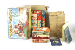 An assortment of vintage children's games and books.