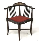 An Edwardian mahogany corner chair.
