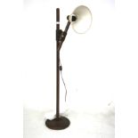 A 20th century stained wood standard lamp.
