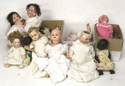A collection of assorted bisque porcelain and other dolls. Max.