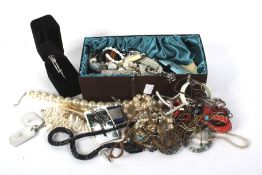 An assortment of costume jewellery. Including beads, necklaces, a bangle, earrings, etc.