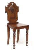 A Victorian mahogany hall chair.