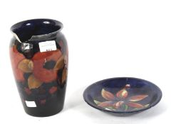 Two pieces of Moorcroft. Comprising a vase in the pomegranate pattern, H20.
