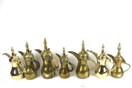 Five vintage Middle Eastern brass coffee pots and two contemporary stainless steel examples. Max.