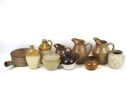 A collection of studio pottery. Including jugs, a stoneware flagon.
