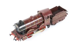 A Hornby O gauge clockwork tinplate locomotive and tender. 0-4-0, LMS livery, no.