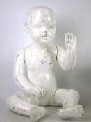 A 1960s articulated toddler mannequin. With detachable limbs.