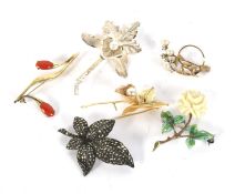 Six floral brooches.