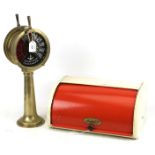 A vintage enamel bread bin and model ships brass telegraph.