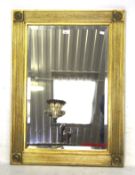 A contemporary gilt framed bevelled edge mirror.