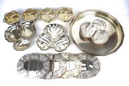 An assortment of contemporary silverplated tableware.