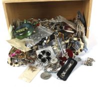 A large assortment of costume jewellery contained within a wooden box marked 'Bread'.