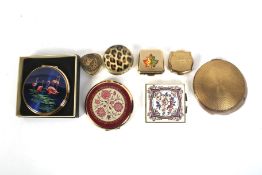 A collection of eight vintage compacts.