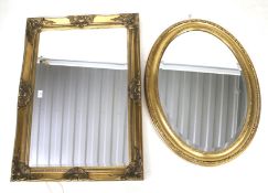 Two contemporary bevelled edge and gilt framed wall mirrors.