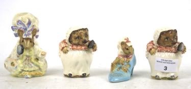 A group of four vintage Beswick Beatrix Potter figures.