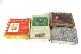 Three vintage wooden jigsaw puzzles and a box of costume jewellery.