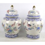 A pair of contemporary oriental style lidded vases.