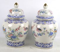 A pair of contemporary oriental style lidded vases.