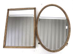 Two wooden framed bevel edge wall mirrors. One rectangular 68cm x 50cm and one oval.