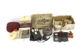 An assortment of vintage camera related equipment and accessories.