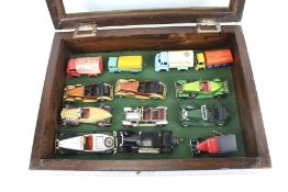 A display cabinet with diecast model vehicles.