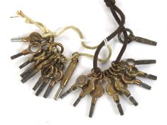 Nineteen vintage pocket watch keys.