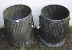 Two metal garden planter bins.